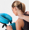 Woman receiving a neck massage on a massage chair