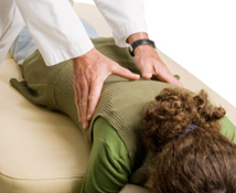 Chiropractor providing a massage to a patient